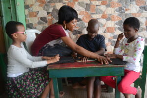 A picture of young blind children learning how to read and write braille